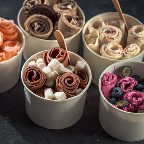 rolled-ice-creams-cone-cups-dark-background